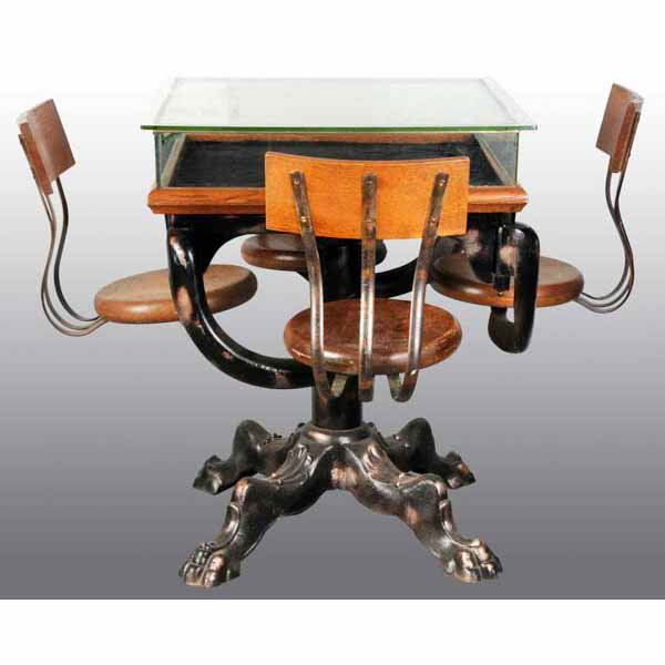 Soda Fountain Display Table.: Attached chairs. Claw feet. Beautiful casting and detail.