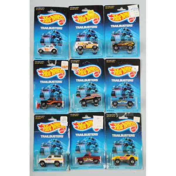 Lot of 16: Mattel Hot Wheels Trailbuster Vehicles: Includes one Tall Rider, Baja Bug, Bywayman, Bronco 4-Wheeler, Baja Breaker, Monster Vet, Blazer, and other duplicates. Mint in packages, five bubbles with yellowing and some creasing and wear to card