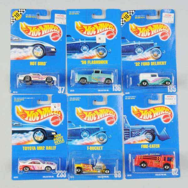 Lot of 50: Mattel Hot Wheels Blue Card Vehicles.: Includes no. 68 T-Bucket, no. 33 Camaro Z-28, no. 72 School Bus, no. 37 Hot Bird, no. 28 1937 Bugatti, no. 70 Chevy Stocker, and others. Mint on cards, some with waviness. Not all pictured.