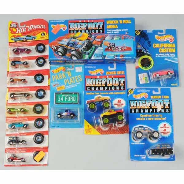 Lot of Assorted Mattel Hot Wheels Vehicles.: Includes one min Big Foot Champions Wreck and Roll Arena set sealed in box, one Big Foot Champions Snake Bite car, one Big Foot Champions Terror Tank, eight 25th Anniversary Red Lines, two Park and Pl