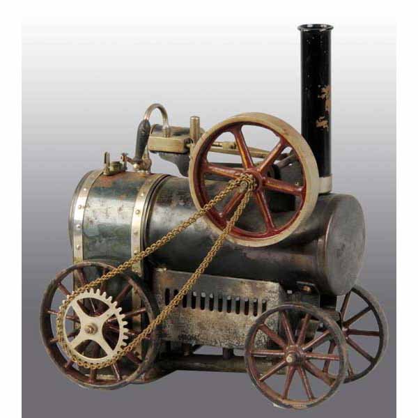 Doll & Co. No. 502/3 Live Steam Traction Engine.: Ca. 1912 to the 1930s. This engine includes a weighted safety, a whistle, a steam line valve and a stationary cylinder. It has its original drive chain and burner. It also has the slotted flame guard.