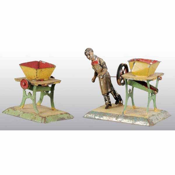 Lot of 2:Bing Turnip Cutter Steam Toy Accessories: One is operated by a workman. This one has a bent hopper. The other is a stand alone cutter. Paint loss. Largest: 4" x 4 - 1/2".