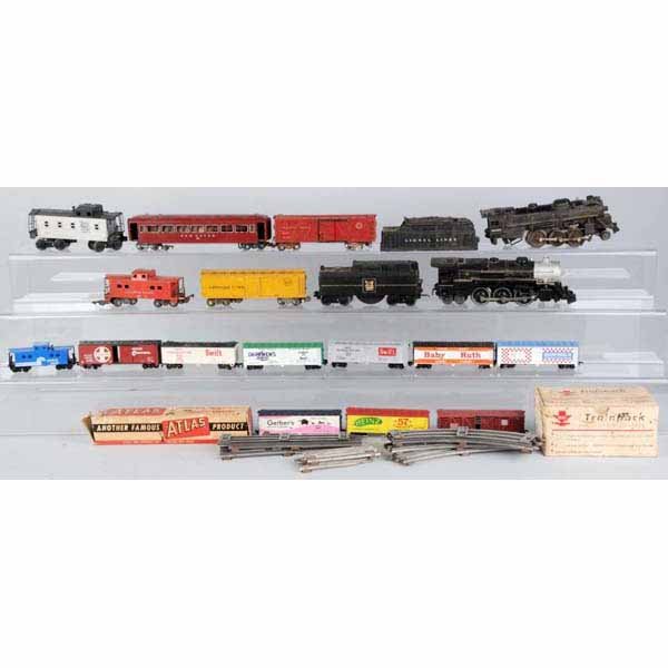 Lot of Miscellaneous Vintage Trains & Accessories: Includes two large boxes of switches and o-gauge track. Also includes some HO and o-gauge trains.