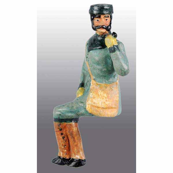 German Early Composition Coach Figure.: Very rare and interesting figure. Seated and looking to the side, while smoking a pipe. Items appears on page 29 of David Presslands (Great Book of Tin Toys) seated on a French horsedrawn coach. Small