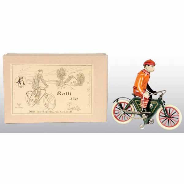 Lot of 2: Tin German Wind-Up Toys.: German. Contemporary. Working. Includes one unused motorcycle in original box marked "Rolli No. 230". Largest: 8" x 7".