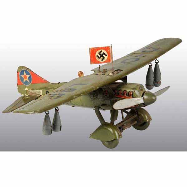 Tin German Tipco Airplane Wind-Up Toy.: German. Working. Marked "D-O LAF" on wings. Propeller spins. Includes four original metal bombs, pilot, and flag. Original back tail fins are detached but present with some glue residue on one. Wingsp