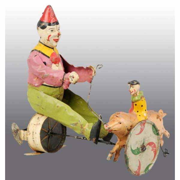 Tin Hand-Painted Clowns & Pig Wind-Up Toy: German. 1900s. Possibly Gunthermen or Bing. Working. When wound, smaller clown on pig rides around bigger clown and toy emits plink-plink sound. 8" x 8".