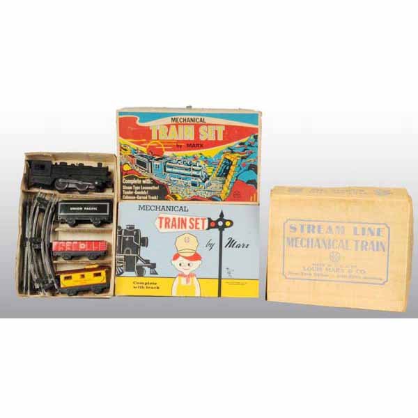 Lot of 3: Tin Marx Wind-Up Train Sets.: American. All are steam engine freight-type sets. Two sets have plastic engines and are fairly identical with Union Pacific tenders, gondolas, and Union Pacific cabooses. The third is an earlier set w