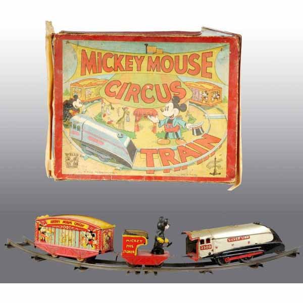 Wells Walt Disney Mickey Mouse Circus Train Toy.: English. Working. Two pieces of original track and original key. Mickey moves back and forth to shovel while train is in operation. One car shows Mickey and Minnie Mouse with circus animals on both si
