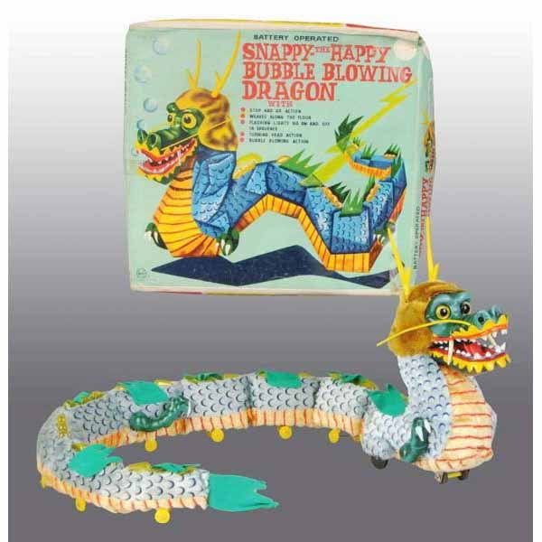 Marx Snappy the Happy Bubble Blowing Dragon Toy.: American. Battery-operated toy is working and takes four batteries to run. Lights up and rolls forward. Mouth opens to blow bubbles but there is no bubble solution left. No bubble damage on mouth and