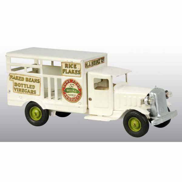 Pressed Steel Metalcraft Heinz Pickle Truck Toy.: American. Nice decals on side and original tailgate. Missing hook with spare tire. Older restoration. 12" L.