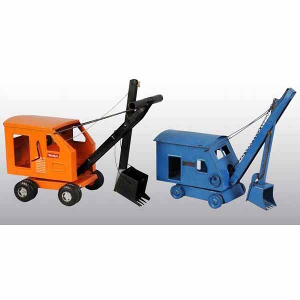 Lot of 3: Pressed Steel Vehicle Toys.: American. Includes one Tonka Livestock Tractor Trailer, one Buddy L Steam Shovel, and one Structo Steam Shovel. Some scratching and wear throughout. Largest: 23" L.