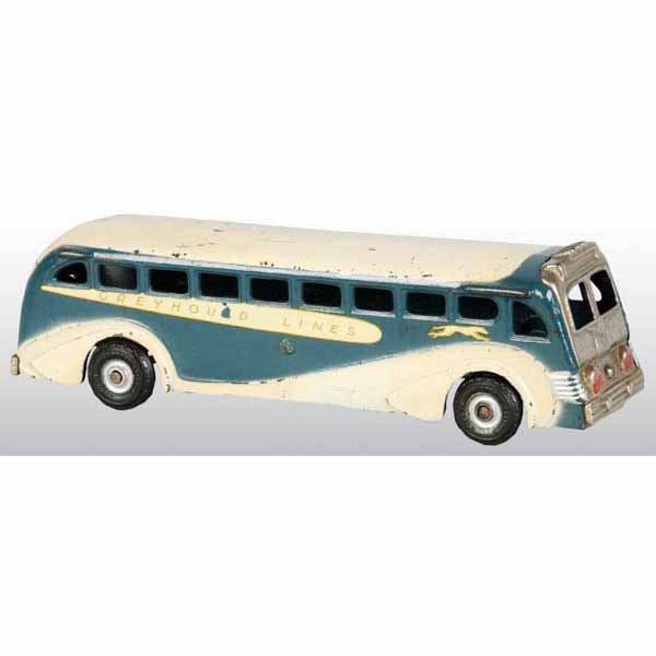 Cast Iron Arcade Greyhound Super Coast Bus Toy.: American. Circa 1937. Greyhound Lines decals on both sides of bus alongside of the running dogs. Moderate overall chipping and wear, especially to roof. 9" L.