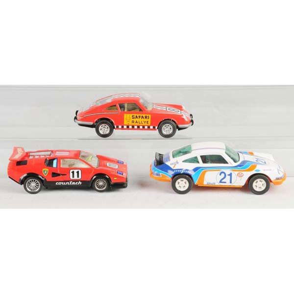 Lot of 3: Tin & Plastic Race Car Toys.: Description French and Japanese. Working. Includes two 1960 Joustra Porsches and one battery-operated race car. Condition (Very Good). Size Largest: 10" L.