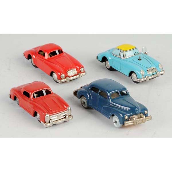 Lot of 4: Tin Automobile Friction & Wind-Up Toys.: Description Japanese. Working. Includes one MGA very nice lithography. Condition (Excellent). Size Largest: 5" L.