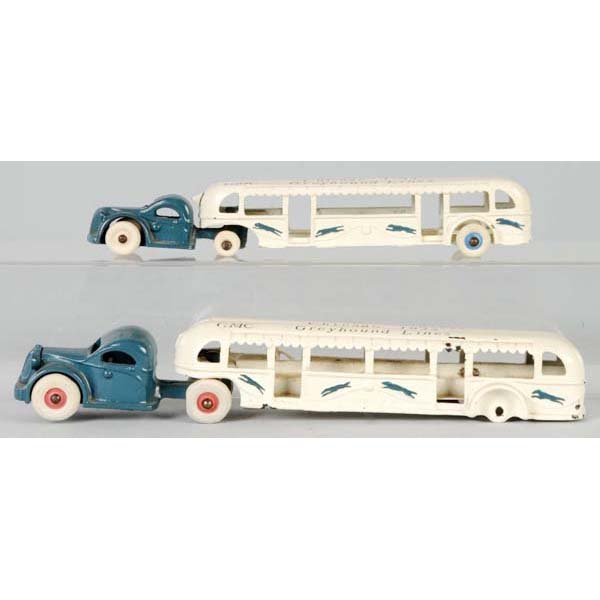 Lot of 2: Cast Iron Arcade Greyhound Bus Toys.: Description American. 1933 World's Fair items. Both are restored with new tires. Larger toy is missing two rear wheels and axle. Condition (Restored). Size Largest: 12 - 1/2" L.
