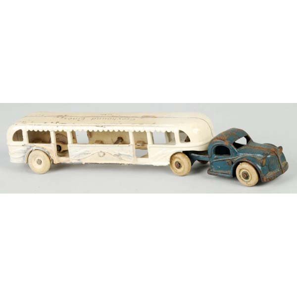 Cast Iron Arcade GMC Greyhound Bus Toy.: Description American. Tractor trailer with white rubber tires. Marked "Greyhound Lines GMC" on roof. Moderate paint loss and wear. Condition (Good - Very Good). Size 10 - 1/4" L.