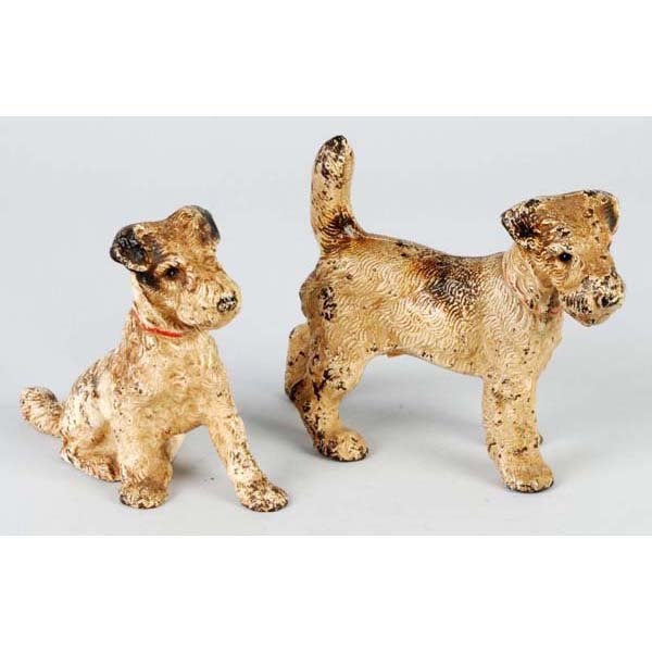 Lot of 2: Cast Iron Fox Terrier Doorstops.: Description Made by Hubley. Includes one sitting and one standing variation. Condition (Good). Size Largest: 5" T.