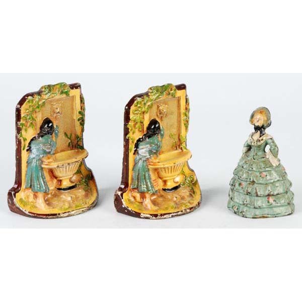 Lot of 2: Bookends & Doorstop.: Description Made by Albany Foundry. Includes Lady at Fountain bookends and Lady with Hoop Skirt doorstop. Condition (Excellent). Size Largest: 5 - 1/2" T.