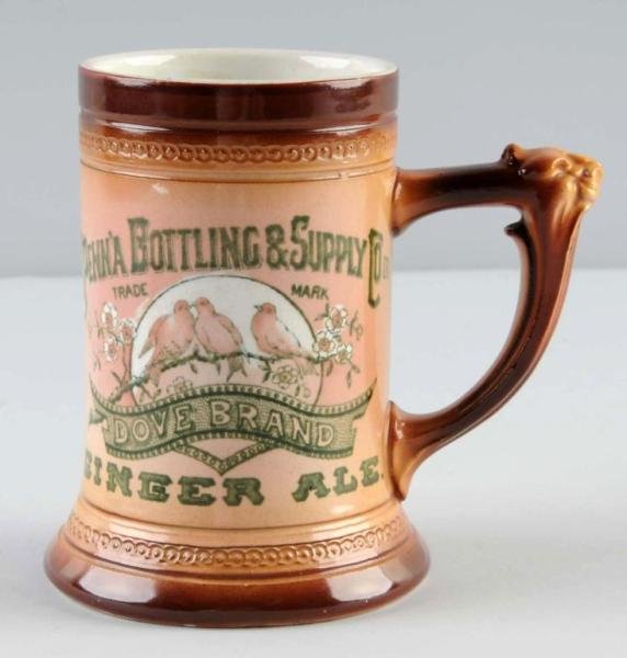 Pennsylvania Bottling & Supply Co. Fancy Soda Mug: Circa 1900. Advertises Dove brand Ginger Ale. Wonderful graphics with only minor marks or light wear. Size: 5" T.