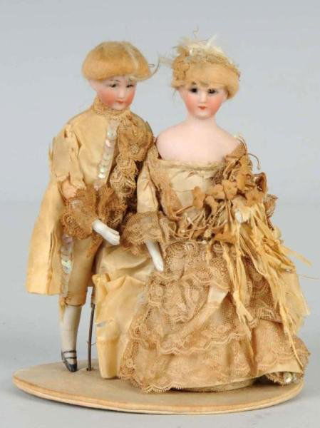 Pair of Simon & Halbig Bride & Groom Dolls.: Bisque shoulder heads incised 1160, glass eyes, closed mouths, original mohair wigs are mostly gone, but cotton under lining is there. Bride has a "cone" body with bisque legs. Groom has a cloth body