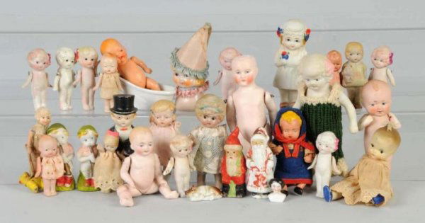 Lot of Small Japanese & German All-Bisque Dolls.: Includes a very nice Germany baby, Santa with molded clothes, Japan china head with clown hat, Japan groom with molded clothes, and a German bisque child with pink boots. Size: Largest: 6" T.