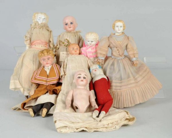 Lot of 8: Antique German Dolls.: Blonde-haired parian with new body; tin head Minerva, all original; celluloid shoulder head baby, all original; blonde bisque shoulder head, all original but broken hands; blonde bisque shoulder head,