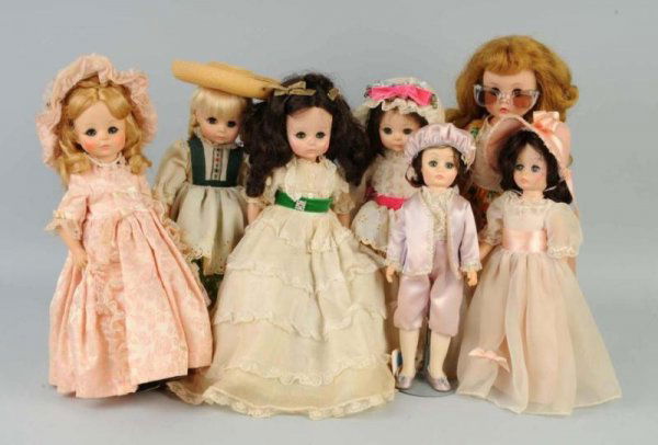 Lot of 7: Madame Alexander Dolls.: Vinyl Marybel, redressed; Gone with the Wind (cheek rub); Pinky and Blue Boy; rare Madame; Heidi; Degas. All have tagged original clothes. Size: Largest: 15" T.