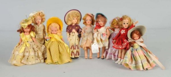 Lot of 9: Costume Dolls.: 4 Bisque Nancy Ann Storybook Dolls, all with stiff legs and original costumes, 1 tagged Spring; Hard Plastic Mary Hartlein and Miss Curity, all original; 2 composition M.B.C. NY dolls, all original; 1