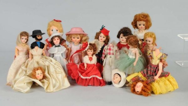 Lot of 14: Plastic Dolls.: 3 Sandra Sues, one all original in plaid dress; 1 Vogue Jill; 3 Ginny-types, one all original with lovely cheek color, and 7 costume dolls. Size: Largest: 9" T.