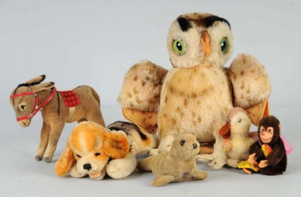 Lot of 6: Small Steiff Animals.: Mohair owl, no tag; early mohair seal (lots of wear); mohair Jocko bendable limbs, all tags; mohair Floppy Beagy with chest tag; fuzzy duck yellow tag #3190.10. Felt donkey with US Zone Germany tag. S