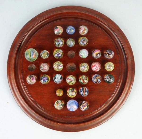 Lot of 21: Handmade Marbles on Original Board.: Includes mostly German swirls with a few onionskins. Size: Largest: 7/8" Dia. CORRECTION – 30 Marbles in Lot, NOT 21.