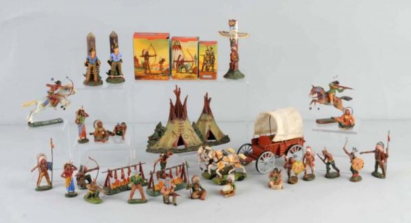Lot of Elastolin Wagon, Teepee, Cowboy- Figures.: Elastolin 70mm composition Cowboys, Indians, and accessories. Contains seventeen unboxed foot Indians, three boxed foot Indians, two-foot Cowboys, two campfires, totem pole, two mounted Indians, two C