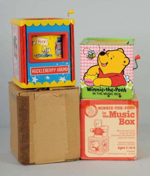 Lot of 2: Character Jack-in-the-Box Toys.: Working. Includes one Huckleberry Hound marked "1959 Hanna–Barbera" made by Knickerbocker and one Winnie the Pooh marked "Walt Disney Productions" made by Mattel. Some scratching throughout. Include
