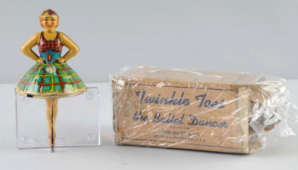 Tin Marx Ballet Dancer Flywheel Toy.: American. Working. Nice colorful lithography. Original flywheel key. Minor scratching throughout. Includes original box with cardboard insert but missing top flaps. Box marked "Twinkle Toes the Ballet