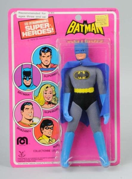 Mego Batman Action Figure.: Marked "1979 Marvel Comics". Foreign packaging. Original price sticker in upper right corner. Package with some creasing to top of card. Size: 8" T.