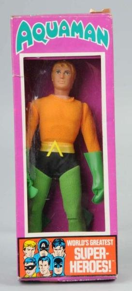 Mego Aquaman Superhero Action Figure.: Marked "1972". Includes original box with one tear to left corner, some edge wear throughout, and pealing to price tag. Size: 8" T.