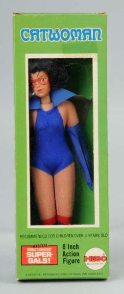 Mego Catwoman Superhero Action Figure.: Marked "1973". Includes original box with price sticker residue in top corner and some creasing to all corners overall. Size: 8" T.