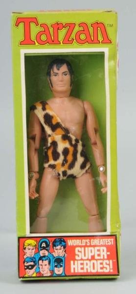 Mego Tarzan Superhero Action Figure.: Marked "1972". Includes original box with some tearing, creasing, and a few pushed-in sections. Size: 8" T.