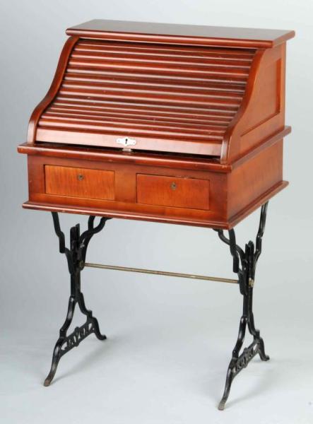 Small Wooden Roll Top Desk.: Circa 1900. Made by a Surgical Company in New Jersey. Two front drawers and one back drawer. Size: 35" T.
