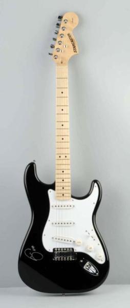 Black Eric Clapton Guitar with COA.: Black Fender Electric Guitar autographed by Eric Clapton at the Crossroads Festival in Chicago, IL on 7.28/07. Signed in silver. Includes COA's from the Legacy Collection and Elite Productions and an 