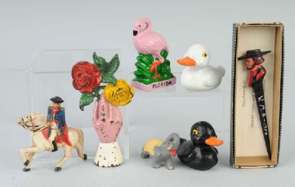 Lot of 7: Cast Iron & Pot Metal Assorted Items.: Includes Amish Man letter opener with original box, one Hand holding bouquet of roses, one Flamingo pencil holder, one Elephant, one Horse with rider, and one set of black and white duck salt and pepp