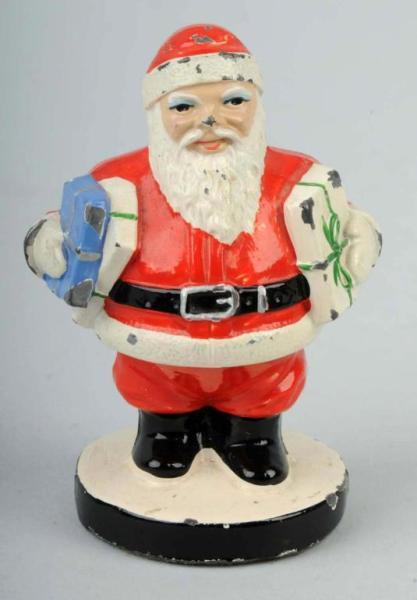 White Metal Santa Claus Paperweight.: Made by Hubley. Catalog number 200. Size: 2 - 3/4" T.