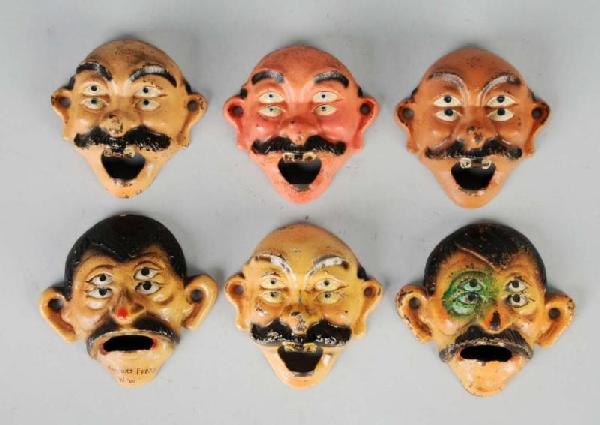 Lot of 6: Cast Iron Double-Eyed Bottle Openers.: Includes four bald double-eyed drunks by Wilton Products and two double-eyed drunks with hair by John Wright. All six are wall mount bottle openers. Size: Each: 4" T.