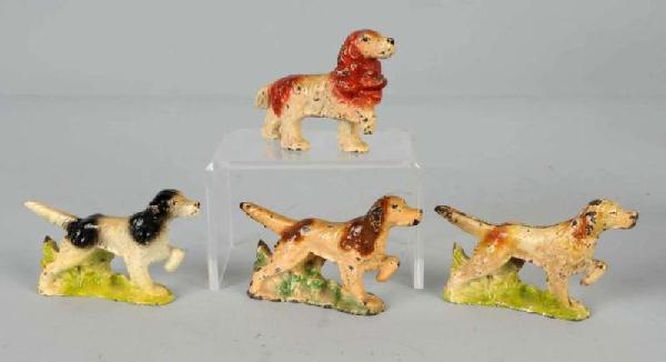 Lot of 4: Cast Iron Dog Bottle Openers.: Includes one Cocker Spaniel and three Setters by John Wright. Size: Largest: 4 - 1/2" L.