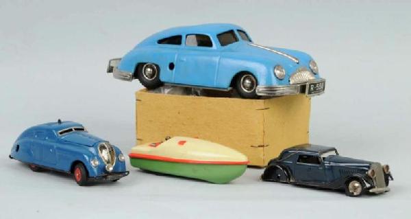 Lot of 4: Tin Friction Cars.: Includes one Porsche with dented roof, one Schuco boat, one Schuco Kommando 2000, and one English car with detached rear wheel/axle and melted tires. Includes one original box. Size: Largest: 9" L.