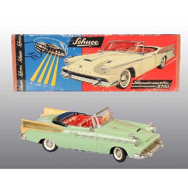 Tin Schuco Packard Automobile Wind-Up Toy.: German. Working. Some wear to back left plastic fin and slight oxidation to chrome. Includes original box with some creasing. Box marked "Synchomatic 5700". Pictured in Dale Kelley's "Collecting the T
