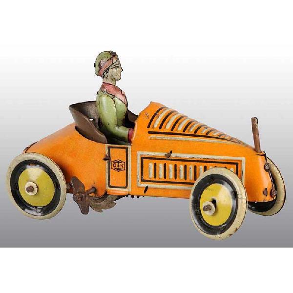 Tin G & K Automobile Wind-Up Toy.: German. Working. Marked "Made in Germany" on rear of car. Tin lithographed female driver. Car is missing front flag with moderate overall wear. Size: 5 - 1/2" L.
