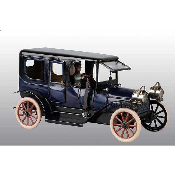 Tin Karl Bub Limousine Clockwork Toy.: German. Working. Original lithographed driver, original front headlights, and gearshift levers on both sides of front doors. Beveled glass windshield. Very little overall wear with some slight spideri