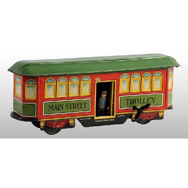 Tin Main Street Trolley Wind-Up Toy.: German. Working. Marked "Nifty" and "Main Street Trolley". When in operation, doors open and close to reveal ticket taker. One small spot of litho loss above door and overall scratching throughout. Si